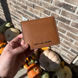 Brown Michael Kors wallet with good hardware